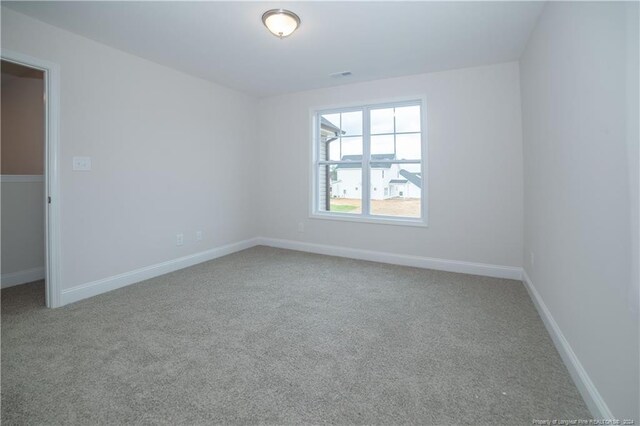 unfurnished room featuring carpet