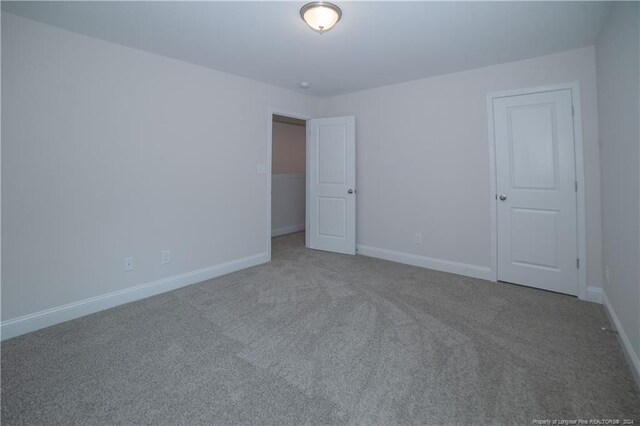 spare room with carpet floors