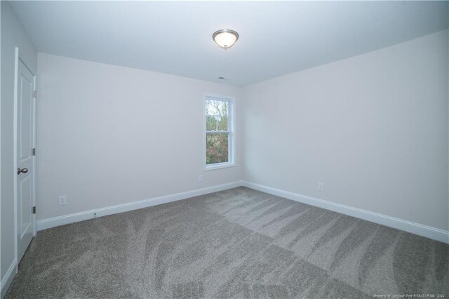 empty room with carpet flooring