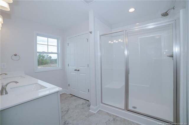 bathroom featuring vanity and walk in shower