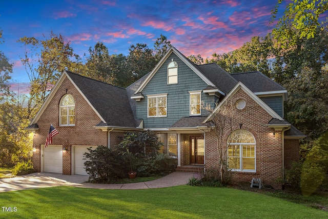 front facade with a yard and a garage