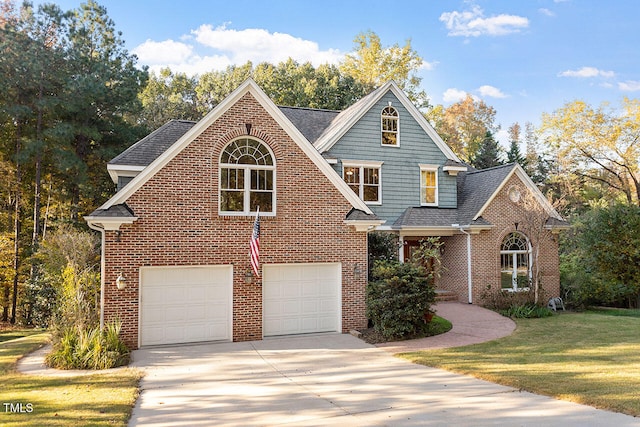 view of front facade with a front yard and a garage