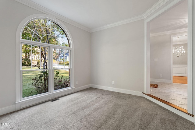 carpeted spare room featuring crown molding and an inviting chandelier