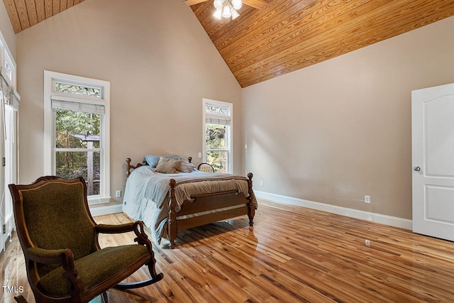 bedroom featuring wood ceiling, high vaulted ceiling, light wood-type flooring, and ceiling fan