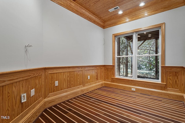 unfurnished room featuring wood ceiling and hardwood / wood-style floors