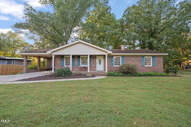 ranch-style house featuring a front yard and a carport