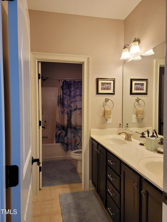 full bathroom featuring tile patterned floors, vanity, toilet, and shower / bath combination with curtain