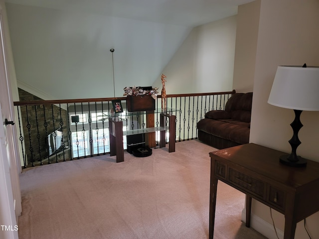 sitting room featuring lofted ceiling and carpet flooring