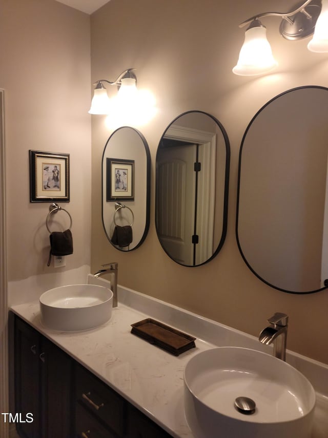 bathroom featuring double vanity and a sink