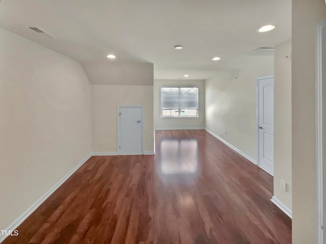 unfurnished room featuring dark hardwood / wood-style flooring