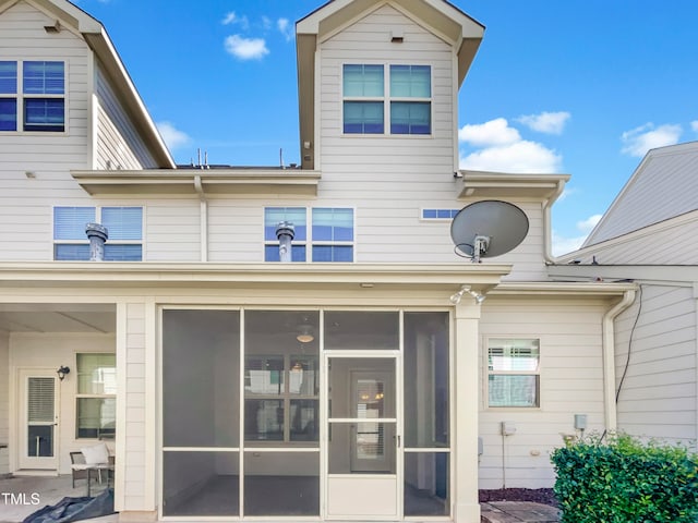 back of property featuring a sunroom