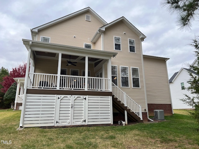 rear view of house with central AC, a lawn, and ceiling fan