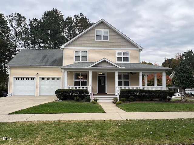 view of front facade with a front yard and covered porch