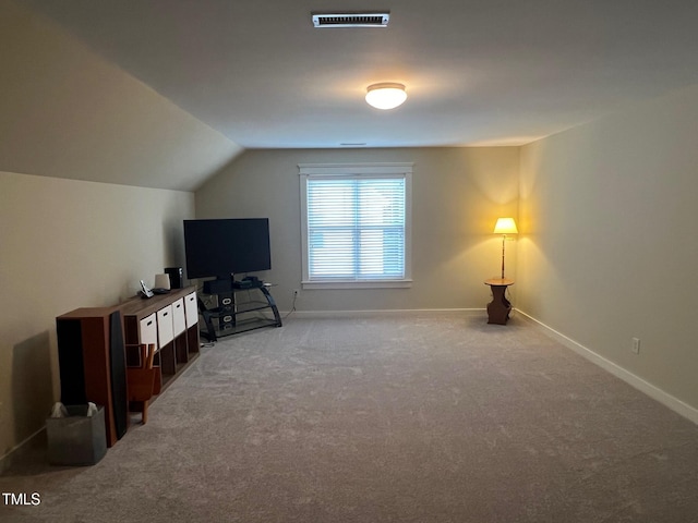 bonus room with lofted ceiling and carpet floors