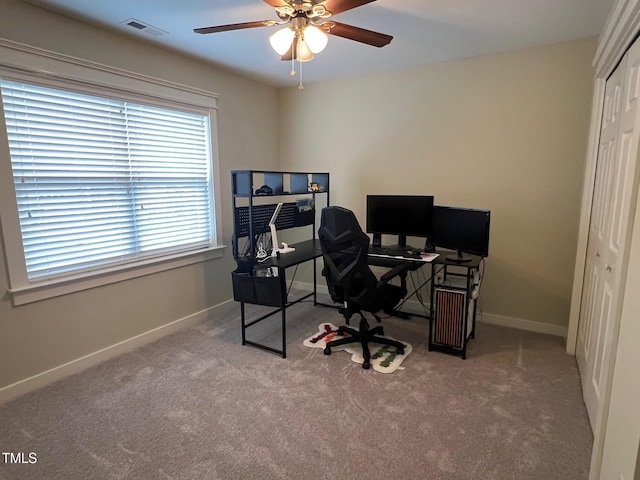 home office with carpet floors and ceiling fan