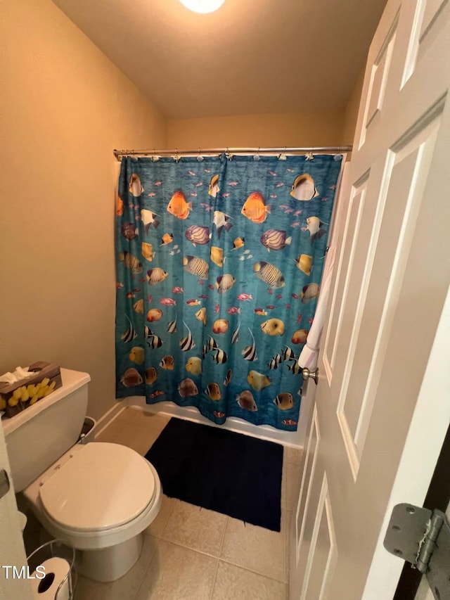 bathroom featuring toilet and tile patterned floors