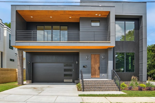 713 N State St, Raleigh, NC 27604 - contemporary home with a balcony, an attached garage, and driveway