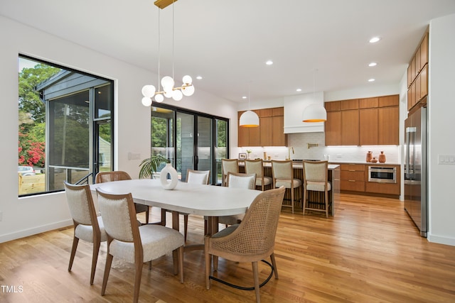 713 N State St, Raleigh, NC 27604 - dining space featuring light wood-type flooring and recessed lighting