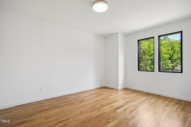 713 N State St, Raleigh, NC 27604 - spare room with light wood finished floors and baseboards