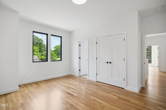 713 N State St, Raleigh, NC 27604 - unfurnished bedroom featuring light wood-type flooring