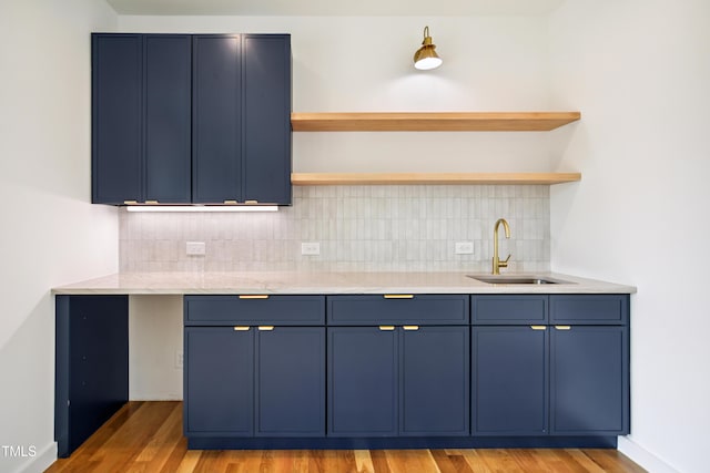 713 N State St, Raleigh, NC 27604 - kitchen with blue cabinetry, open shelves, and tasteful backsplash