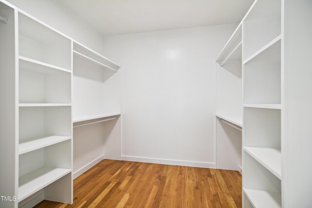 713 N State St, Raleigh, NC 27604 - spacious closet featuring wood finished floors
