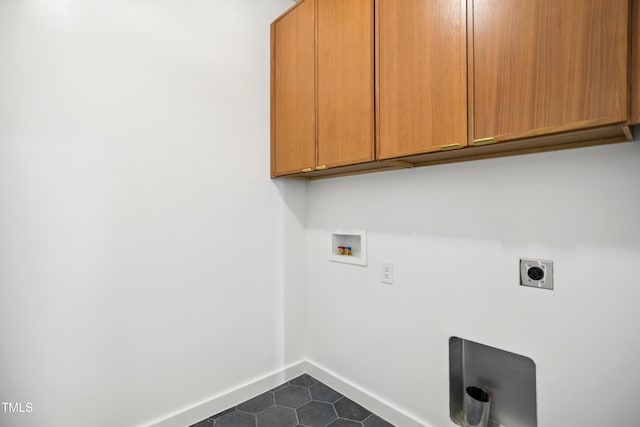 713 N State St, Raleigh, NC 27604 - laundry area with cabinet space, washer hookup, electric dryer hookup, and dark tile patterned floors