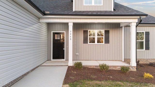 entrance to property featuring covered porch