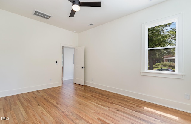 empty room with light wood-type flooring and ceiling fan