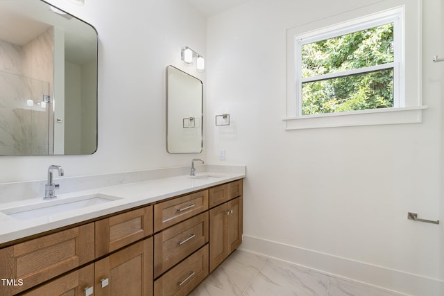 bathroom with walk in shower and vanity