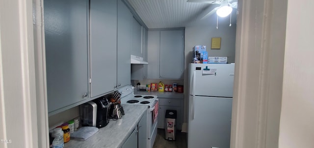 kitchen with range hood, white appliances, and ceiling fan