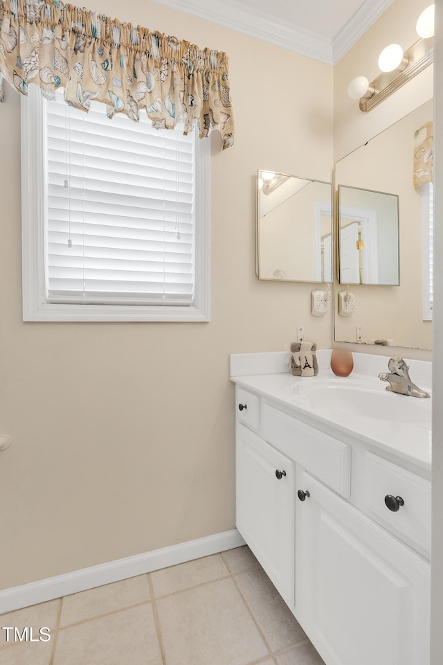 bathroom with tile patterned floors, vanity, and ornamental molding