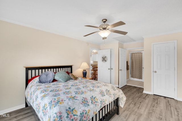 bedroom featuring ceiling fan, hardwood / wood-style floors, and crown molding