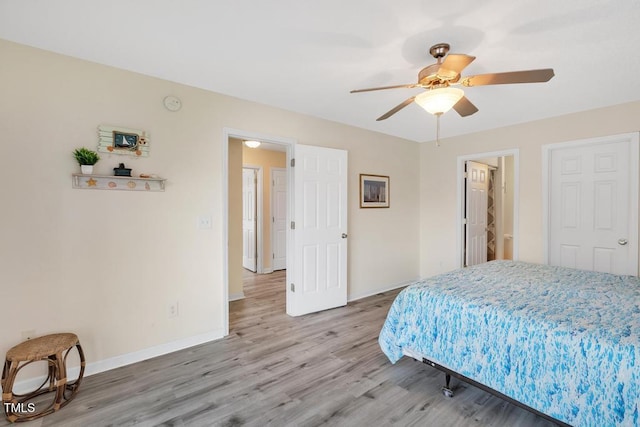 bedroom featuring hardwood / wood-style flooring and ceiling fan