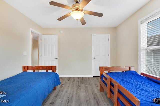 bedroom featuring light hardwood / wood-style floors and ceiling fan