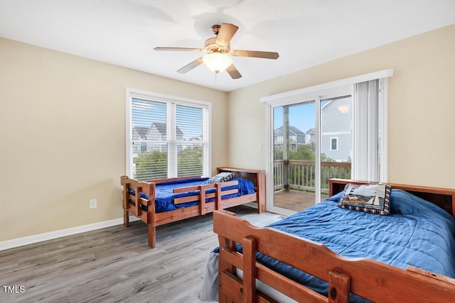 bedroom featuring hardwood / wood-style flooring, ceiling fan, and access to exterior