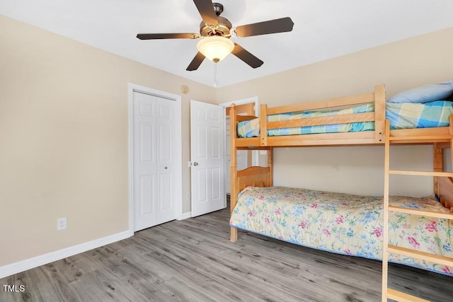 unfurnished bedroom with ceiling fan and wood-type flooring