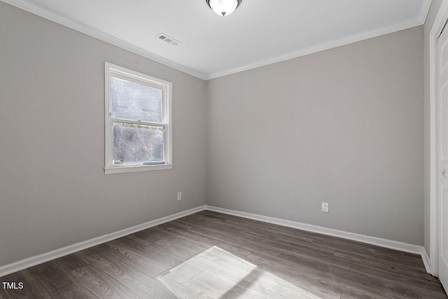 spare room with hardwood / wood-style floors and ornamental molding