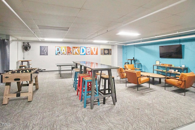 recreation room featuring carpet flooring