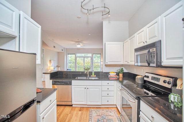 kitchen featuring white cabinetry, sink, ceiling fan, and appliances with stainless steel finishes