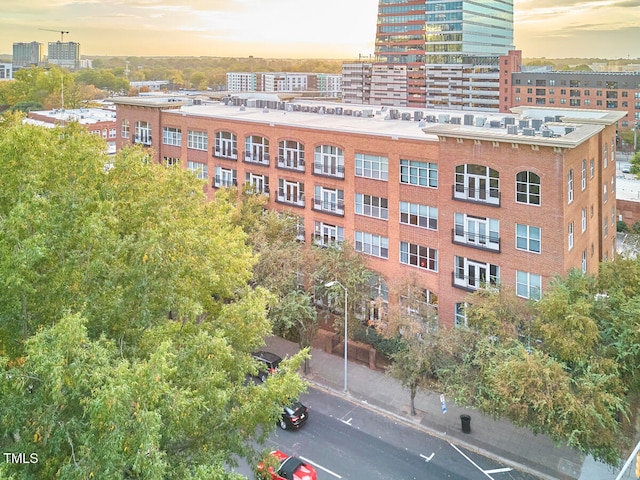 view of outdoor building at dusk