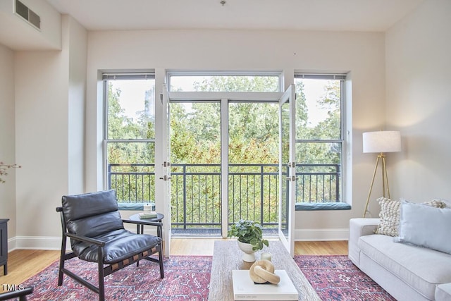 sunroom / solarium featuring plenty of natural light