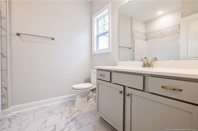 bathroom with walk in shower, vanity, and toilet