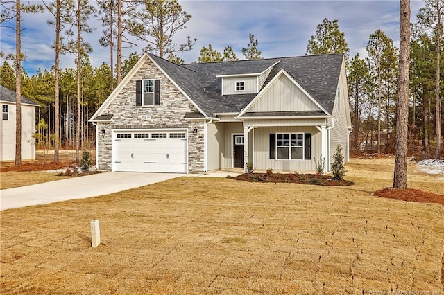 view of front of house with a garage and a front yard