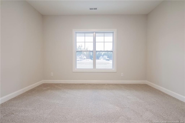 unfurnished room featuring carpet flooring