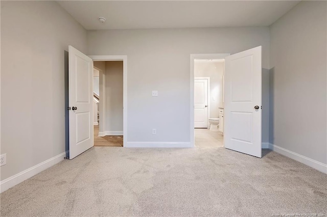 unfurnished bedroom with light carpet