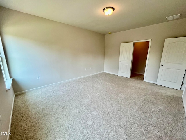 unfurnished bedroom featuring carpet