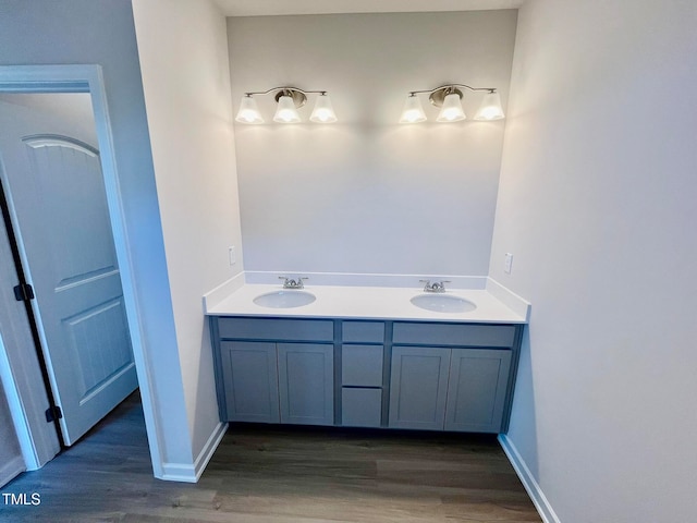 bathroom with vanity and hardwood / wood-style floors