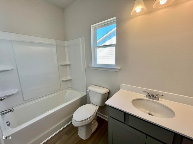 full bathroom with vanity, wood-type flooring, bathing tub / shower combination, and toilet