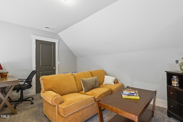 carpeted office with vaulted ceiling